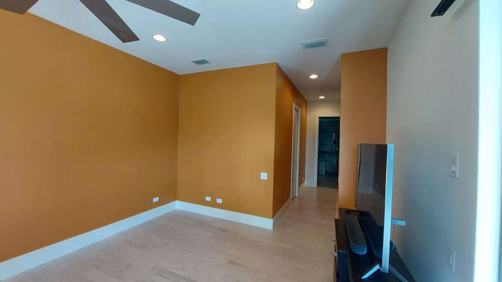 Freshly painted interior room highlighting drywall repair and professional residential painting services.